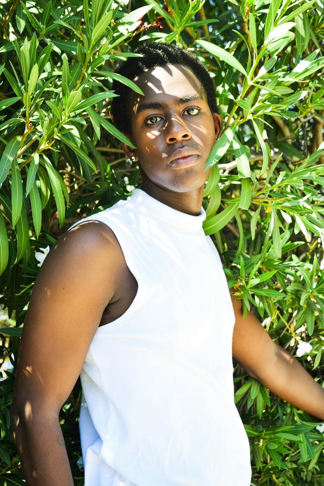 Portrait of a friendly young man of North African descent with short black hair